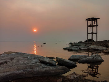 Scenic view of sea against sky during sunset