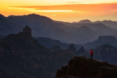 Scenic view of mountains against sky during sunset