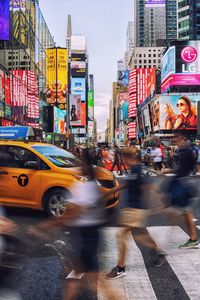 Cars on city street during rainy season