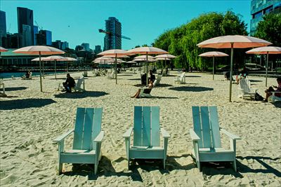 People on beach against clear sky