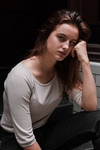 Portrait of young woman sitting