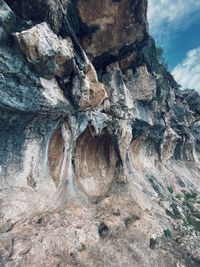 Rock formation in mountains against sky