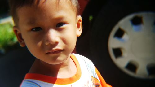 Portrait of cute boy in car