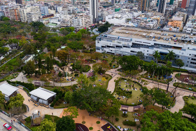 High angle view of buildings and trees in city