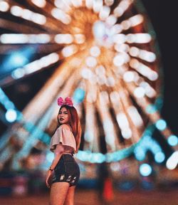 Low angle view of woman in amusement park