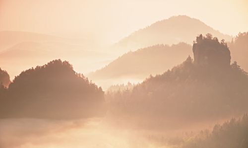 Panoramic view of mountains against sky during sunset