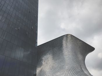 Low angle view of modern building against sky