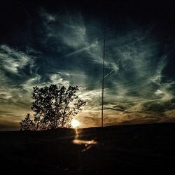 Scenic view of landscape against cloudy sky