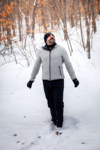 Man standing on snow covered land