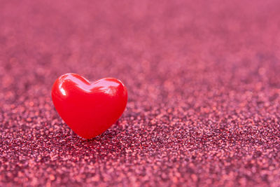 Close-up of heart shape on pink fabric