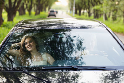 Portrait of woman in car