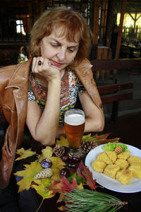 Woman sitting at restaurant table