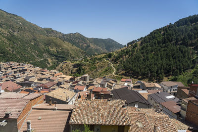 High angle view of townscape against mountains