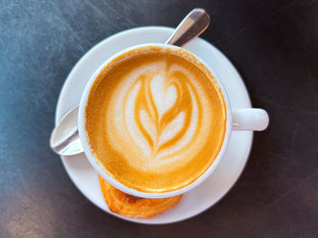 Close-up of cappuccino on table