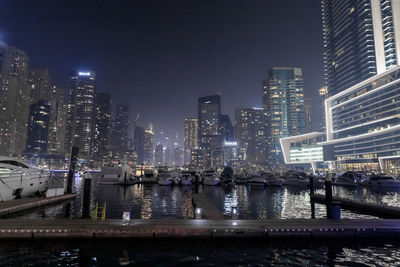 Illuminated buildings in city at night