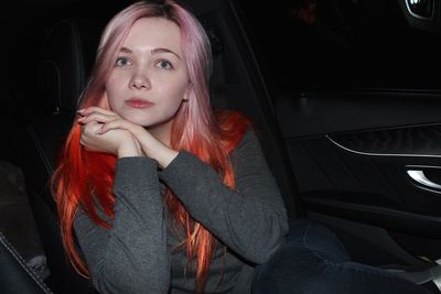 Portrait of woman sitting in car