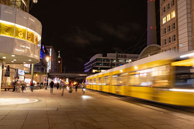 Blurred motion of train at railroad station