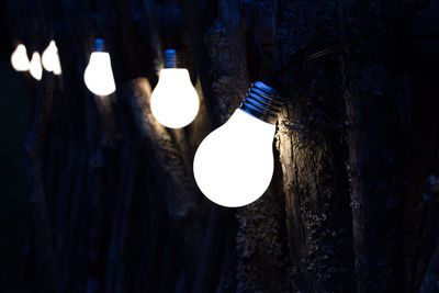Low angle view of illuminated light bulb