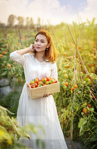 Woman holding flower in a field