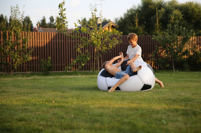 Boys playing in backyard