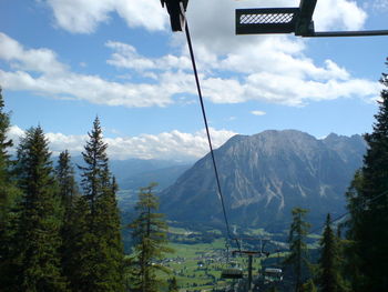 Scenic view of mountains against cloudy sky