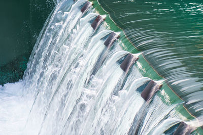 High angle view of water flowing over sea