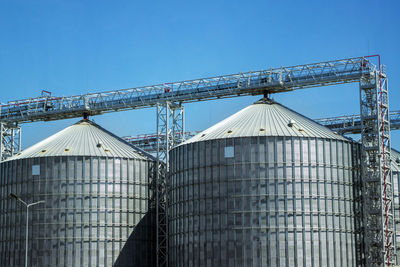 Low angle view of metal structure against sky