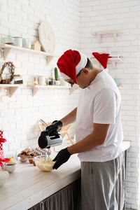 Side view of man preparing food at restaurant