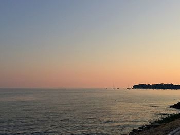 Scenic view of sea at sunset