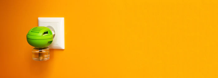 Close-up of usb cable against yellow background