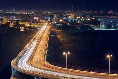 High angle view of light trails on highway at night