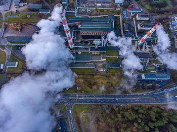 High angle view of smoke emitting from industry