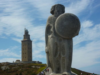 Low angle view of statue against sky