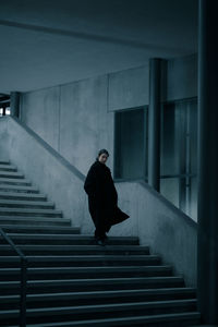 Woman moving on staircase