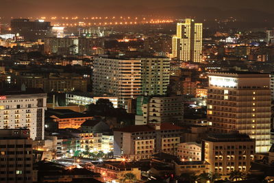 High angle view of illuminated buildings in city at night