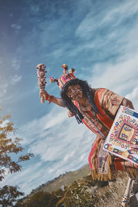 Low angle view of statue against sky