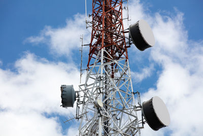 Low angle view of telephone pole against sky