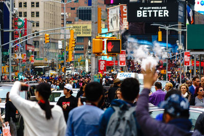 Crowd on street in city
