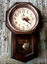 Close-up of clock on wall