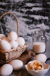 High angle view of eggs in basket on table