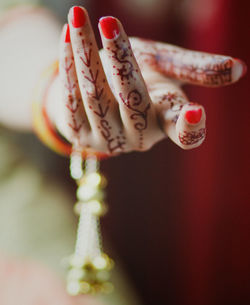 Close-up of female hand with henna tattoo
