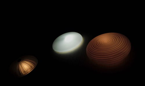 Low angle view of illuminated pendant lights