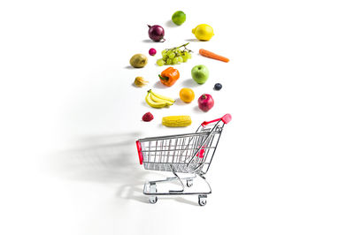 Various fruits over white background