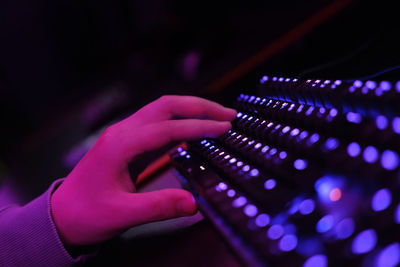 Cropped image of woman using sound mixer