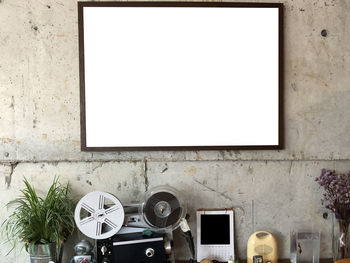 Empty frame on wall in studio