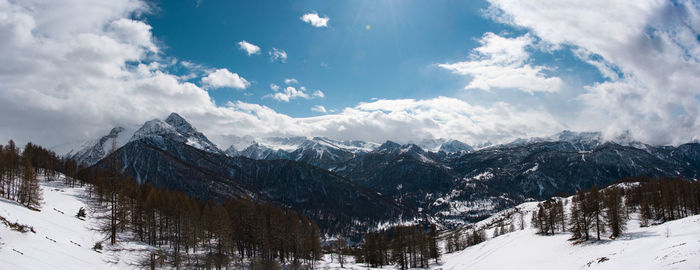 Scenic view of snowcapped mountains against sky