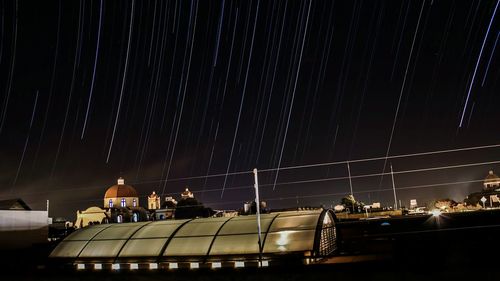 Low angle view of illuminated city at night