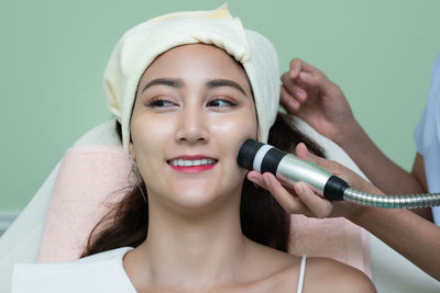 Close-up of woman receiving plastic surgery on face