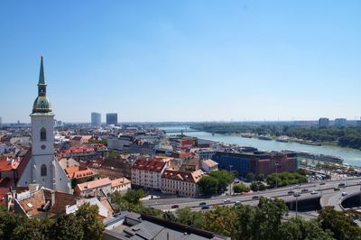 High angle view of buildings in city against clear sky