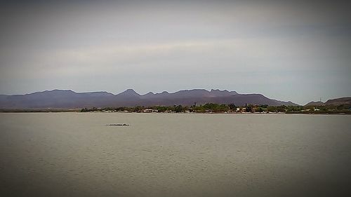 View of lake with mountain range in the background